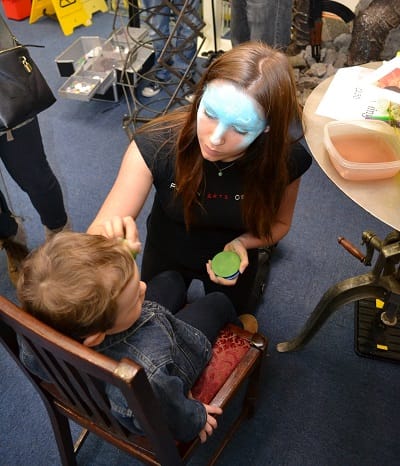 Fusions Arts paint Christmas onto the faces of our younger visitors.