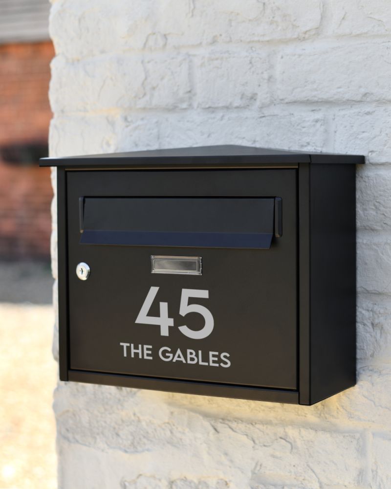 Personalised Steel 'Watts' Wall Mounted Contemporary Post Box In Black