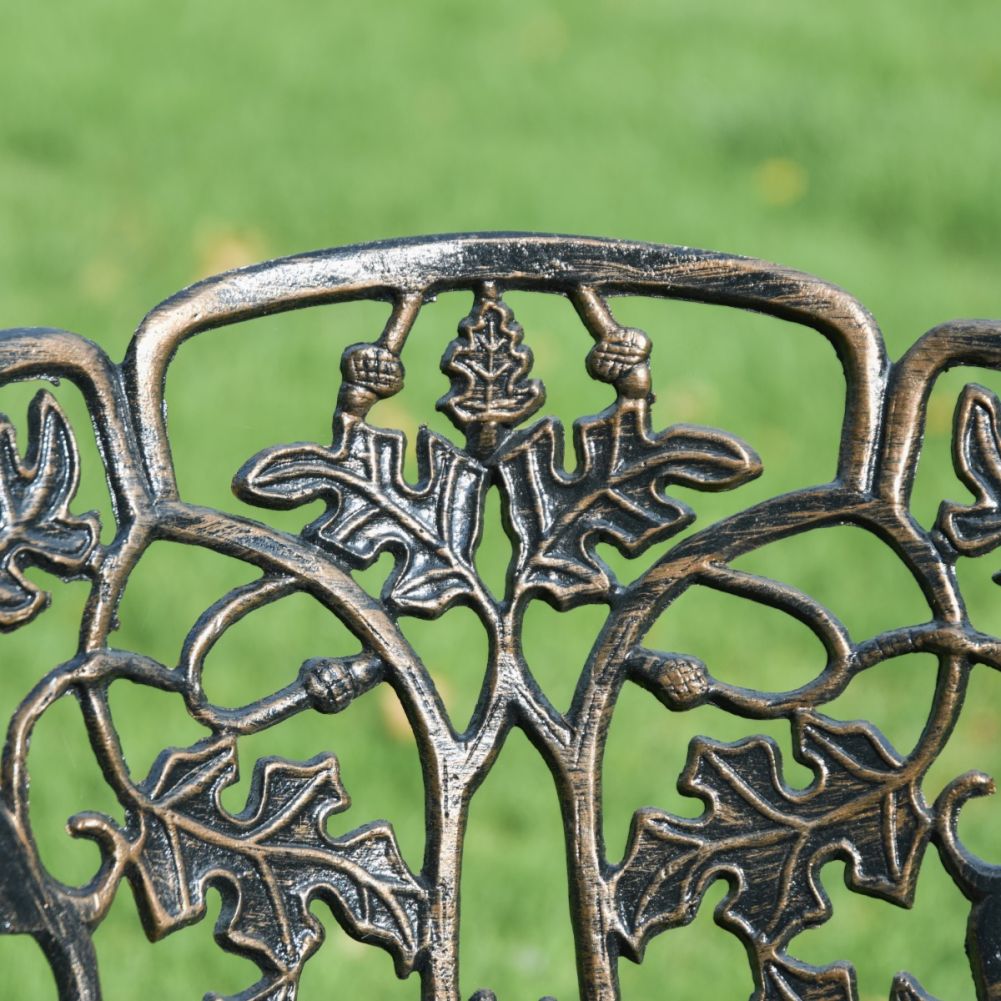 Close Up Of Antique Gold Falling Leaves Four Seater Outdoor Dining Set Chair Back