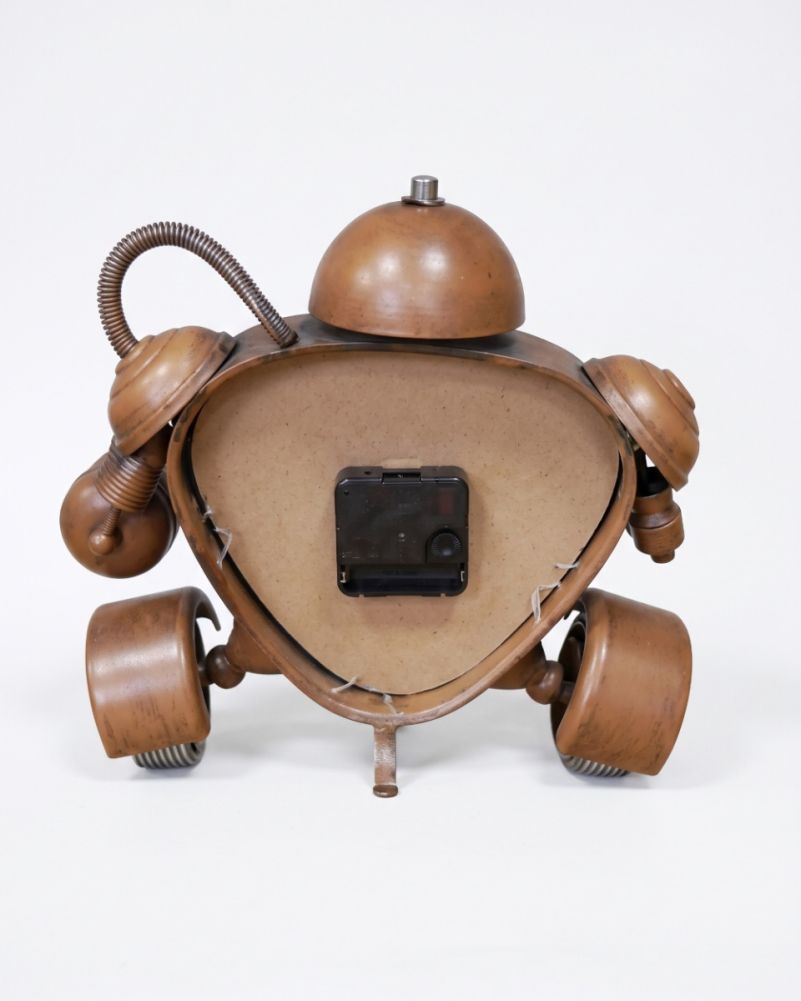 Battery powered metal robotic clock
