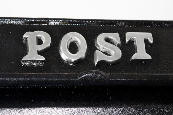 Bright Chrome Welsh Dragon Post Box - Close up of Post