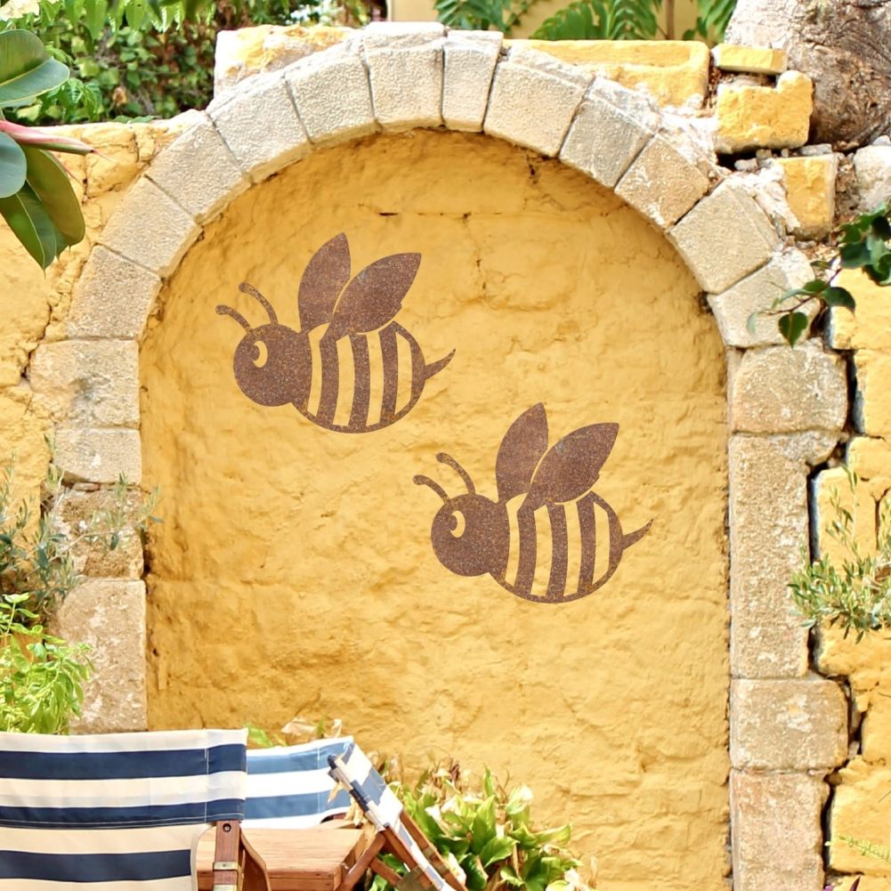 2 Rustic Cartoon Bees On a Yellow Garden Wall
