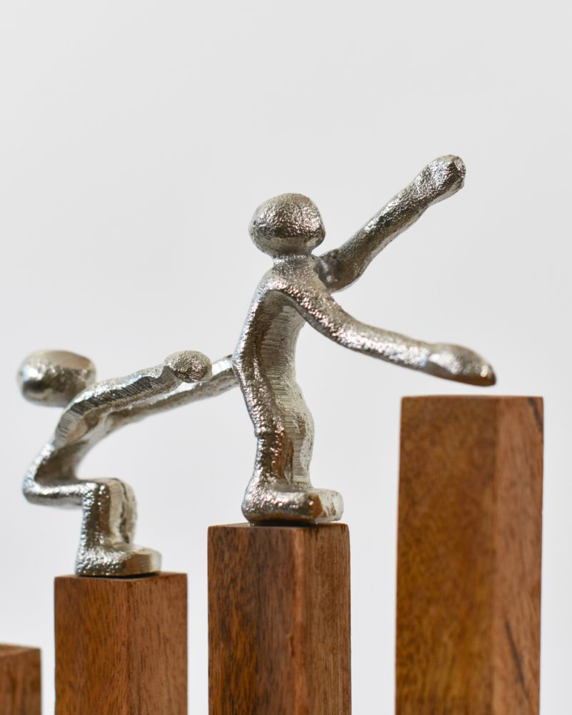 Close Up Of The Silver Cast Aluminium & Mango Wood 'Rising Together' Sculpture
