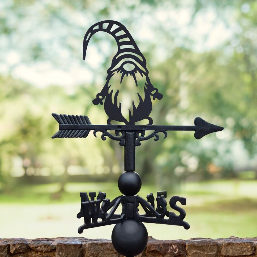 Cast Iron & Steel Gonk with Striped Hat Weathervane in a green garden setting