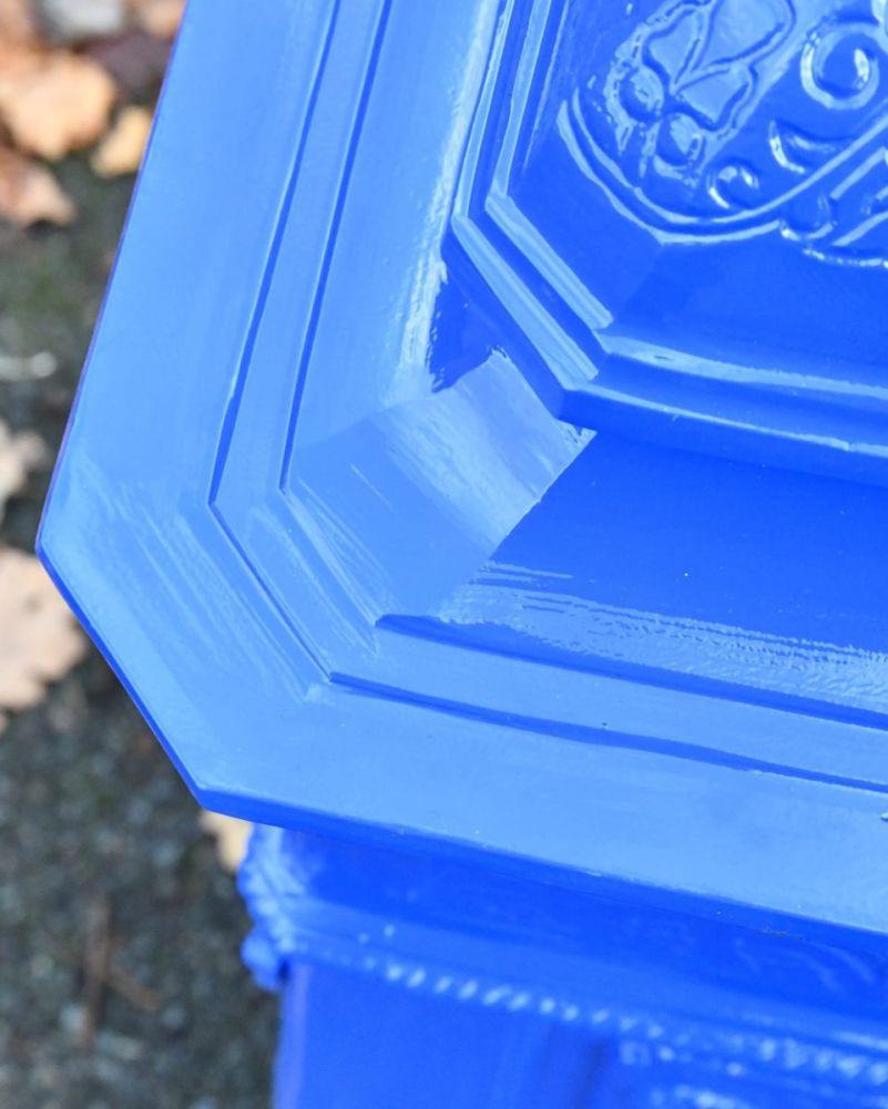 Close up of post box with decorative detailing 