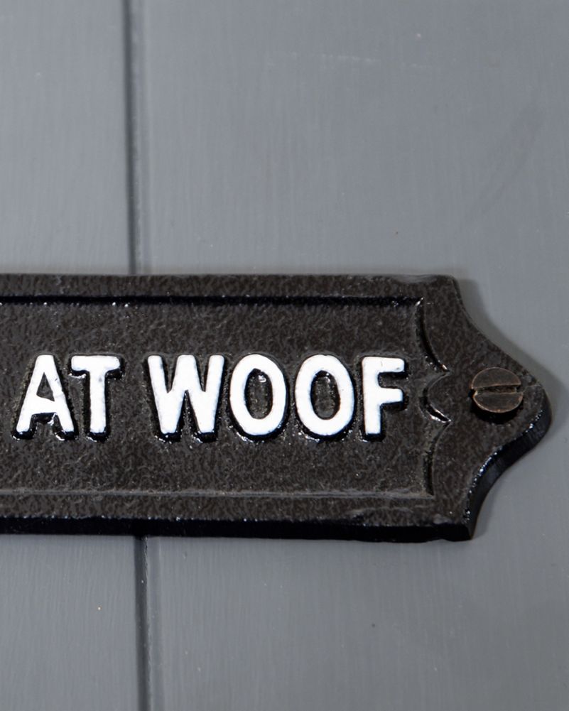 Close Up of The Fixings on The Cast Iron 'Had Me At Woof' Humour Sign