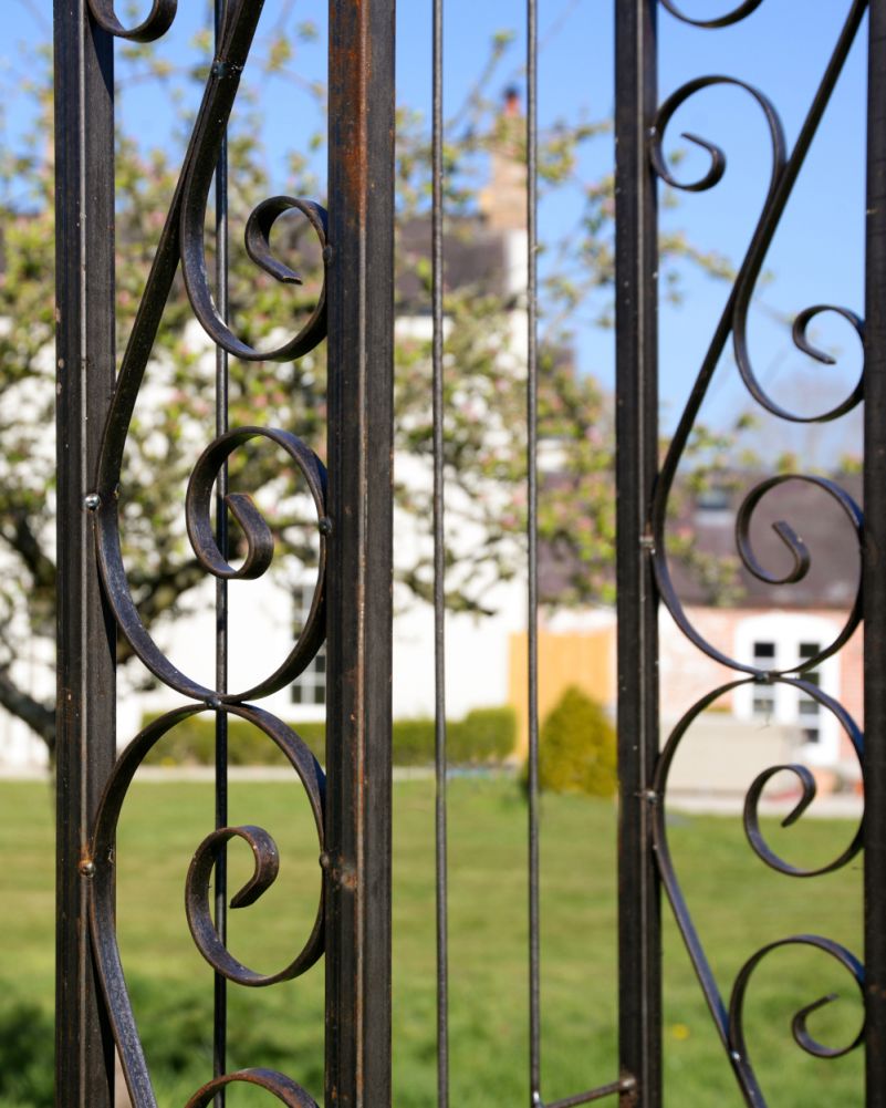Close Up Of The Ornate Scroll Work On A Traditional Garden Rose Arch