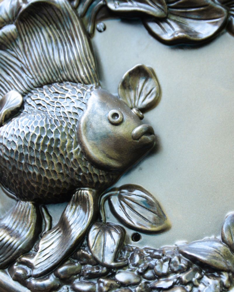 Close Up Of The Face From The Goldfish Naural Bronze House Sign