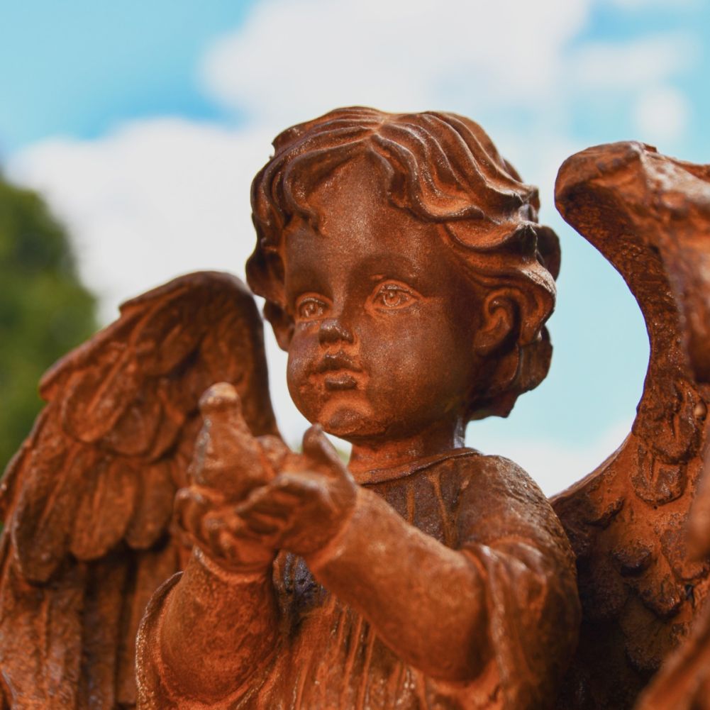 Winged Angel and Dove Cast Iron Rustic Sculpture Face Detail