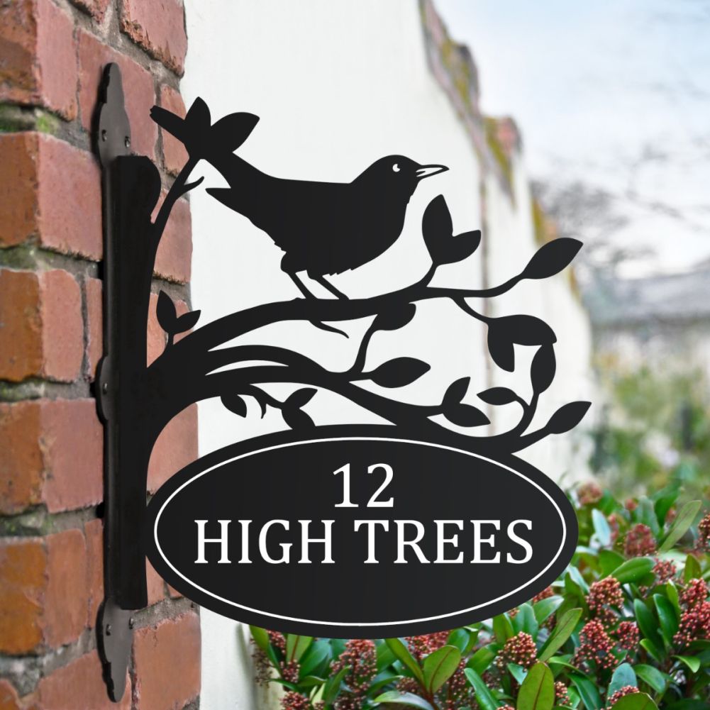 Common Blackbird Iron Bracket House Name Sign On A Brick Wall