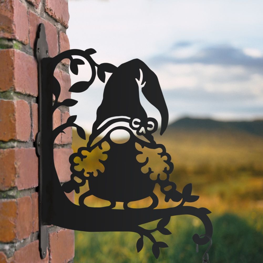 Curly Haired Gonk Hanging Basket Bracket In A Countryside Setting