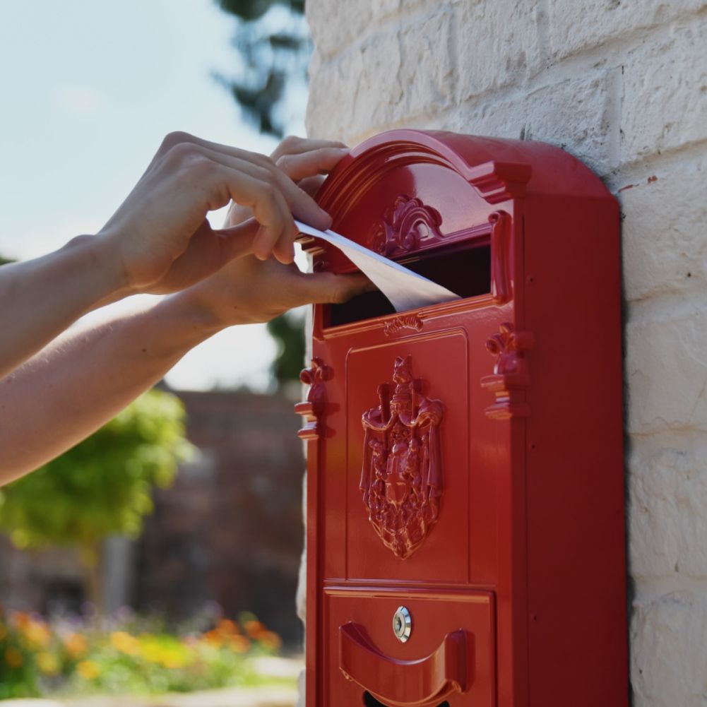 Letter Flap in Use on Dawson Lodge Wall Mounted Post Box In Red