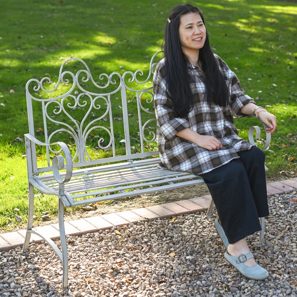 Distressed grey metal bench