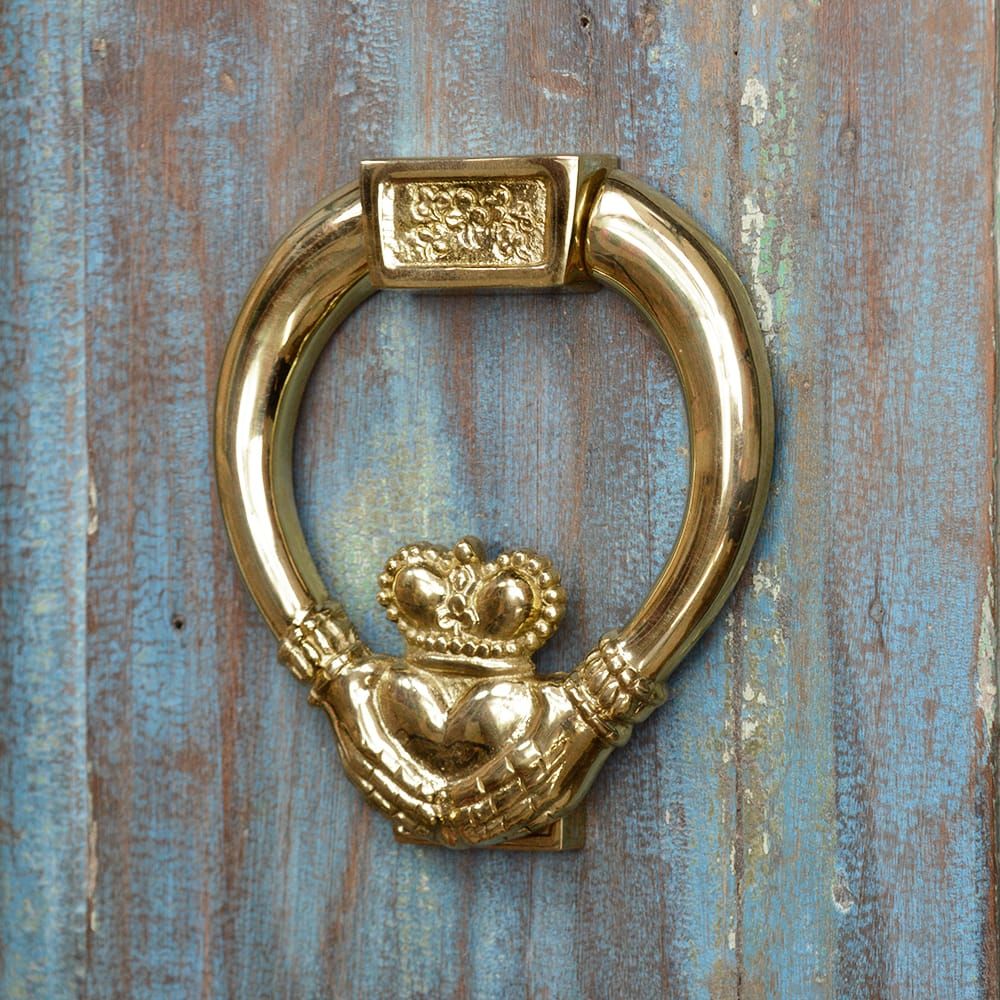 Traditional Polished Brass Claddagh Door Knocker on Rustic Door