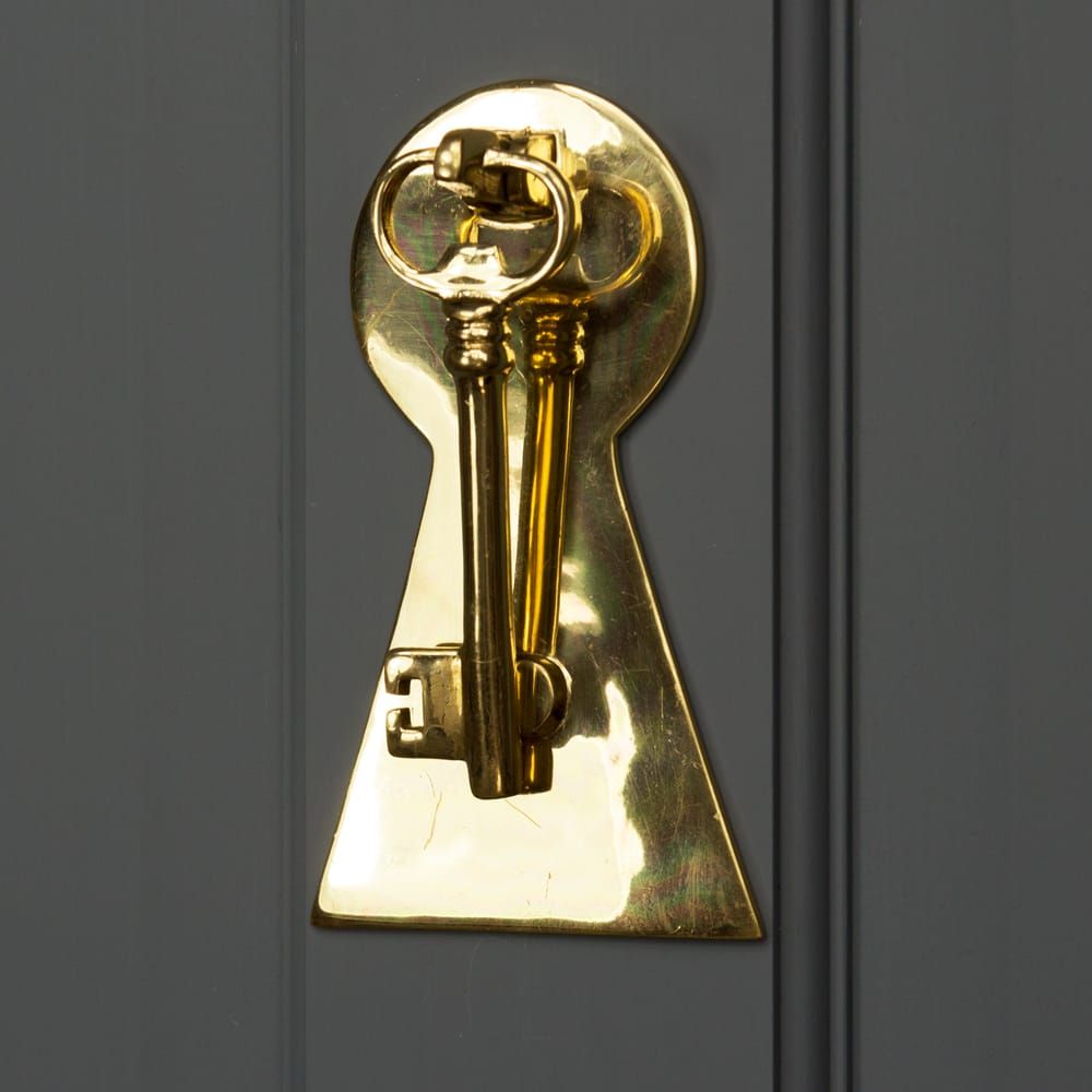 Solid Polished Brass Key Design Door Knocker on Black Door