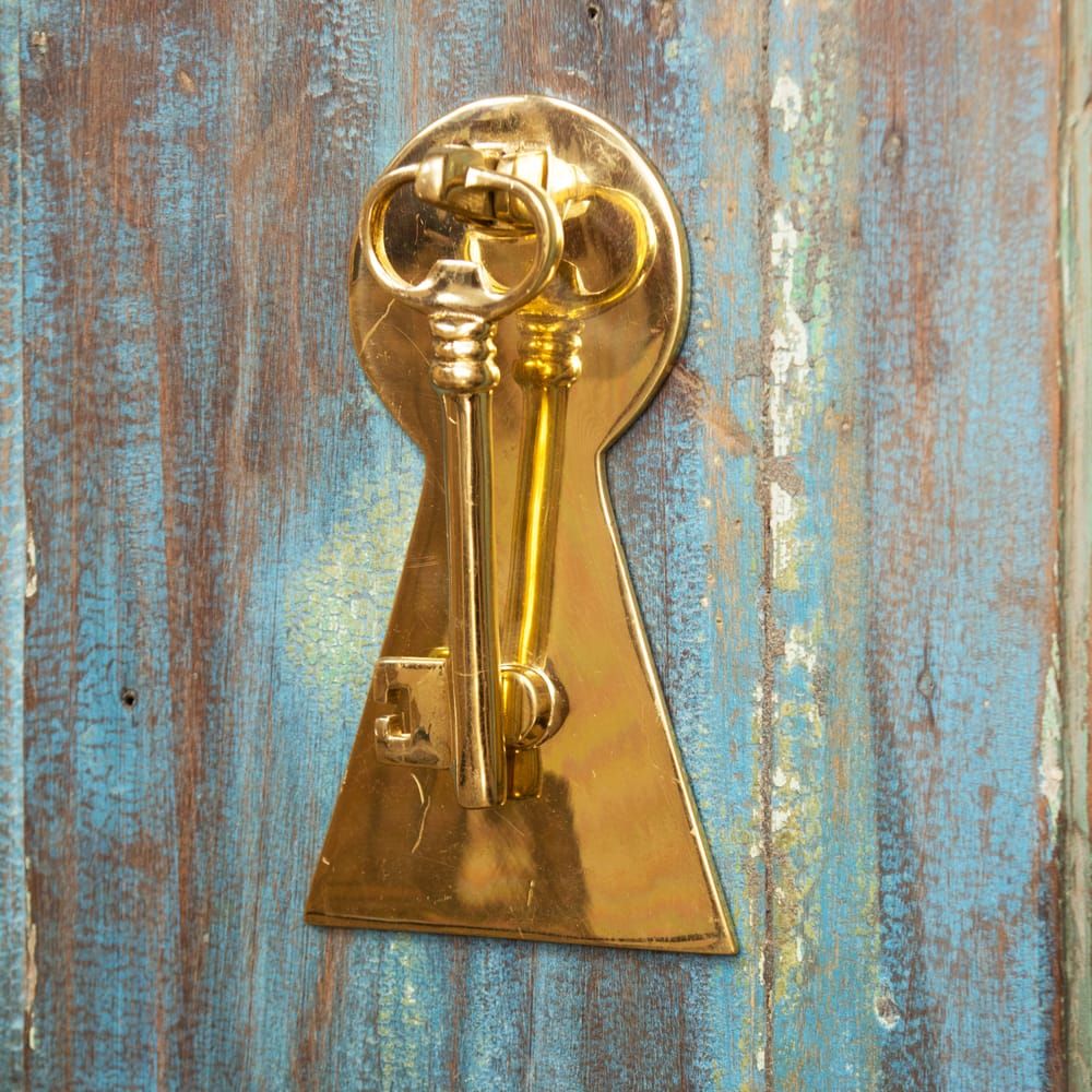 Solid Polished Brass Key Design Door Knocker on Rustic Door