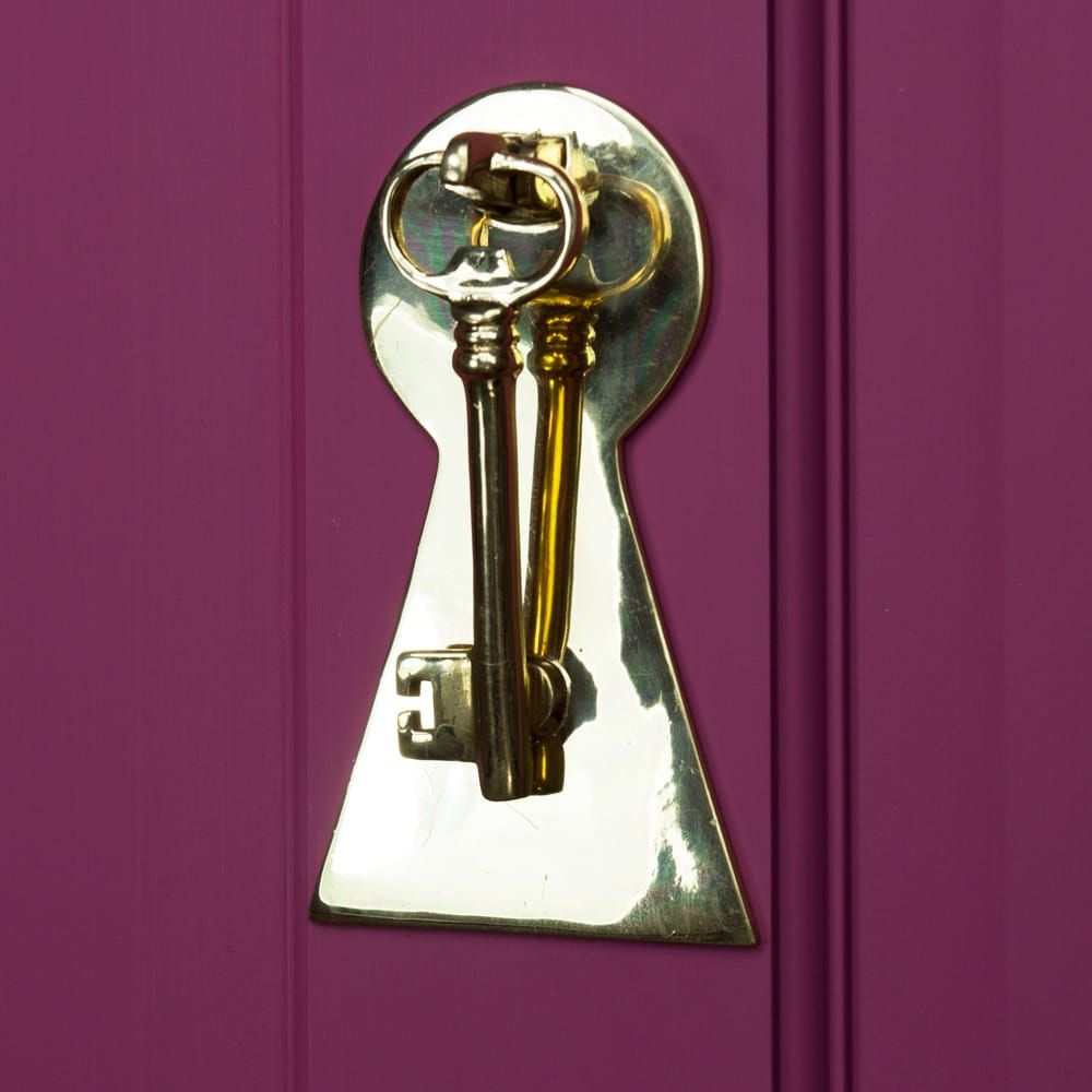 Solid Polished Brass Key Design Door Knocker on Pink Door