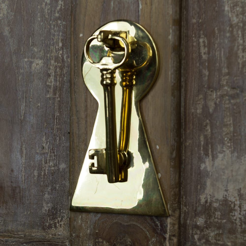 Solid Polished Brass Key Design Door Knocker on Rustic Brown Door