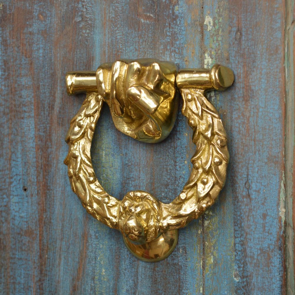 Polished Brass Royal Laurel Wreath Door Knocker on Rustic Door