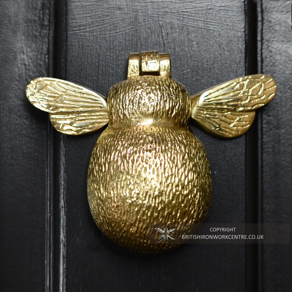 Bumblebee Door Knocker - Polished Brass on Black Door