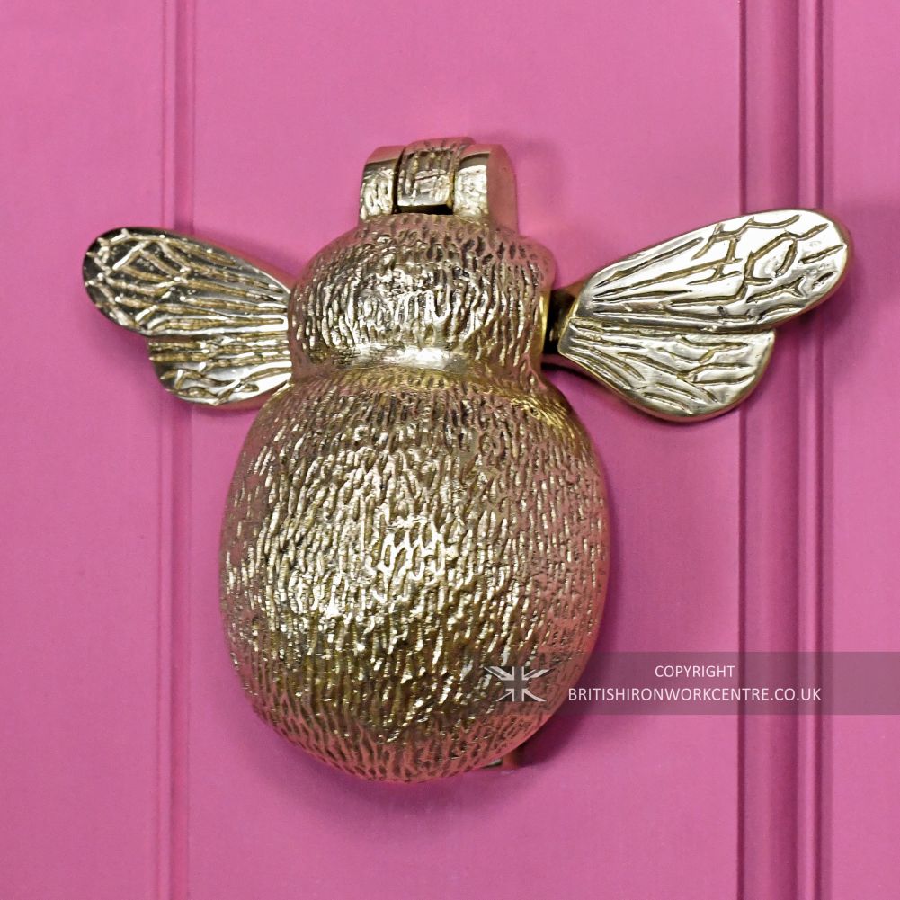 Bumblebee Door Knocker - Polished Brass on Pink Door