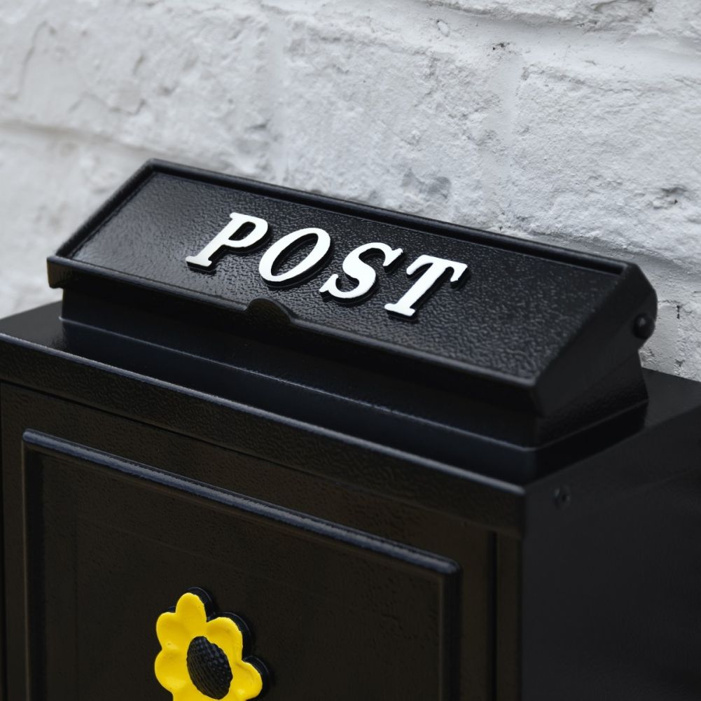 Close up of White 'POST' Lettering on Sunflower Post Box 