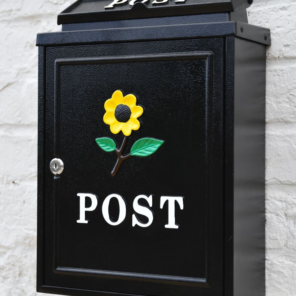 Close up of Yellow Sunflower Motif on Black Post Box 