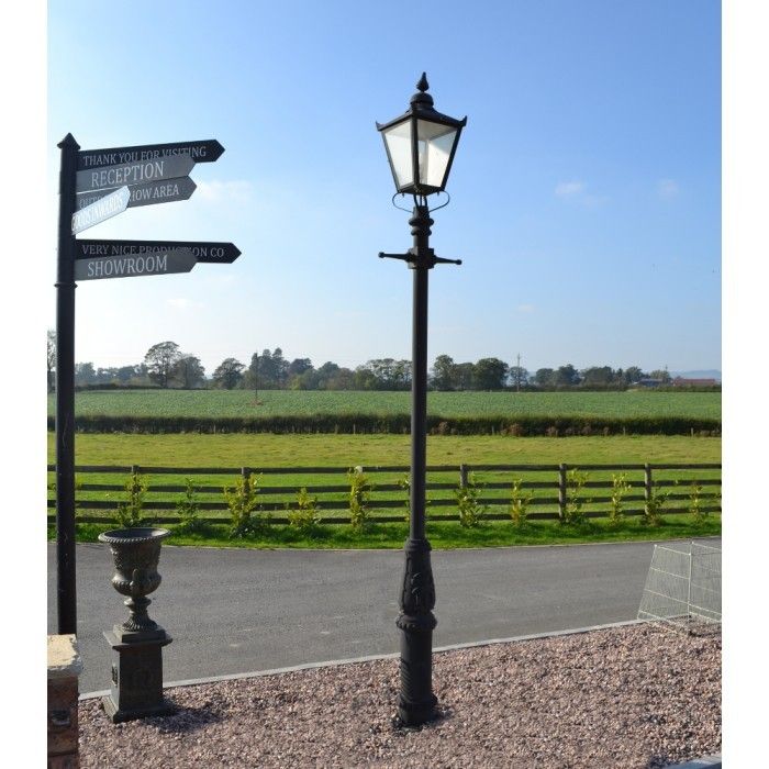 Extra Large Lamp Post Next To Signage 