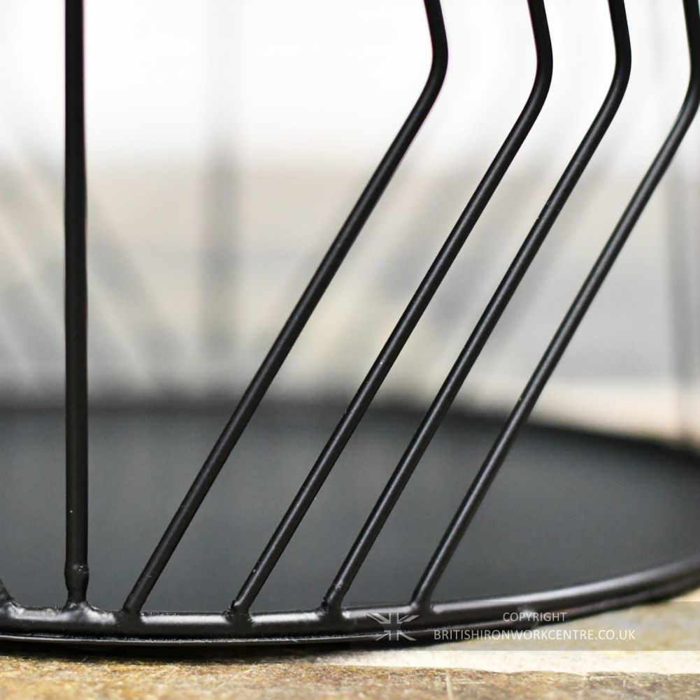 Base Of Small Black Wire Work Design Log Basket