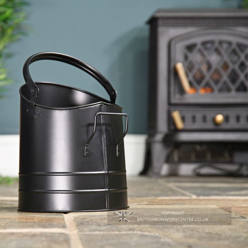 Simplistic Black Coal Bucket to the left of the burner 