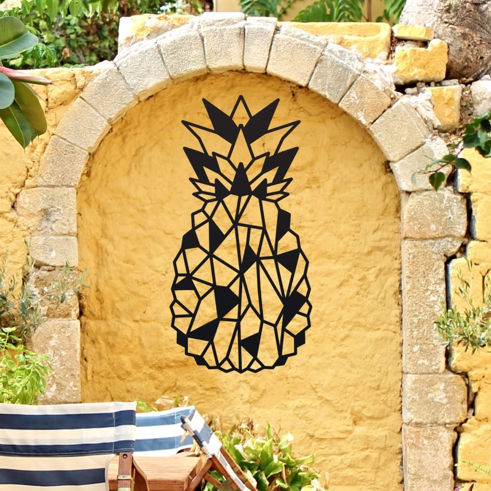 Geometric Steel Pineapple Wall Art on a Yellow Wall