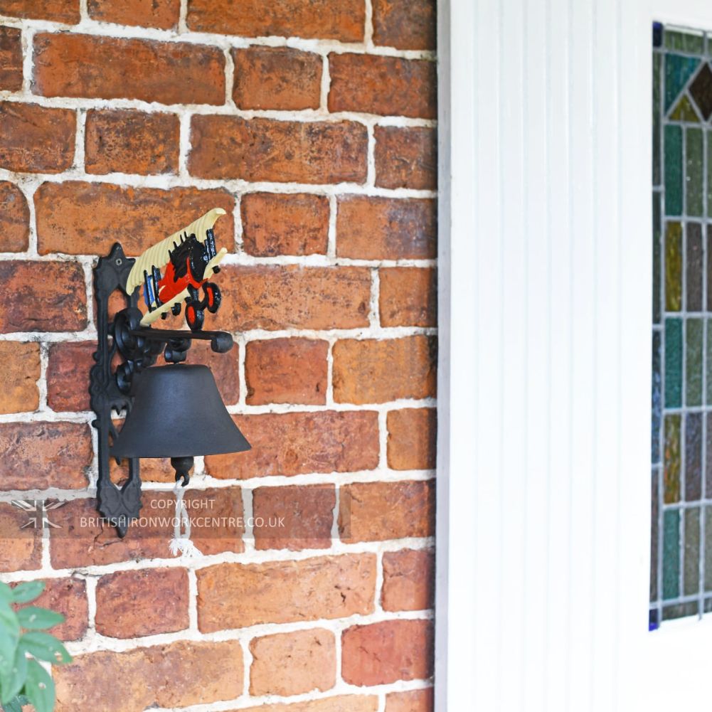 Hand Painted Plane Garden Bell Installed By Front Door