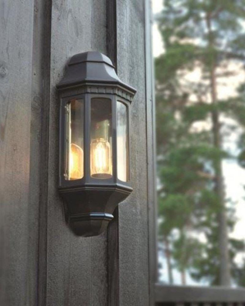 “Holme Abbey” Black Traditional Porch Light In Large in a Forest Setting