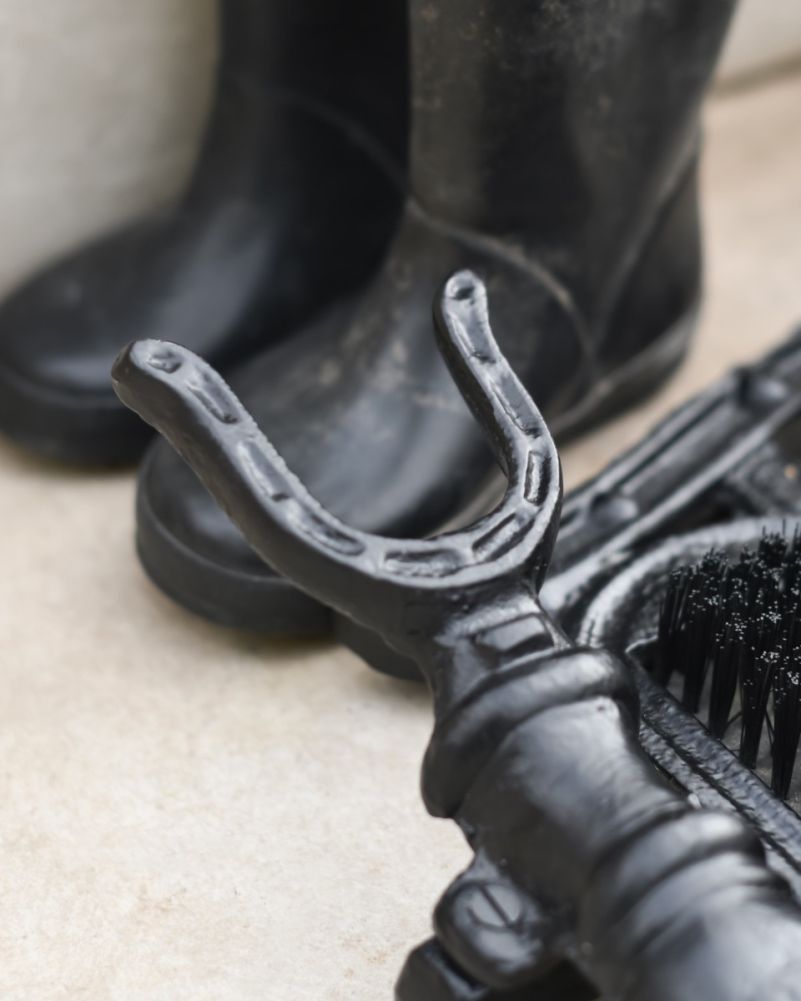 Close Up Of Horse Head Boot Stand & Scraper In Black Jack
