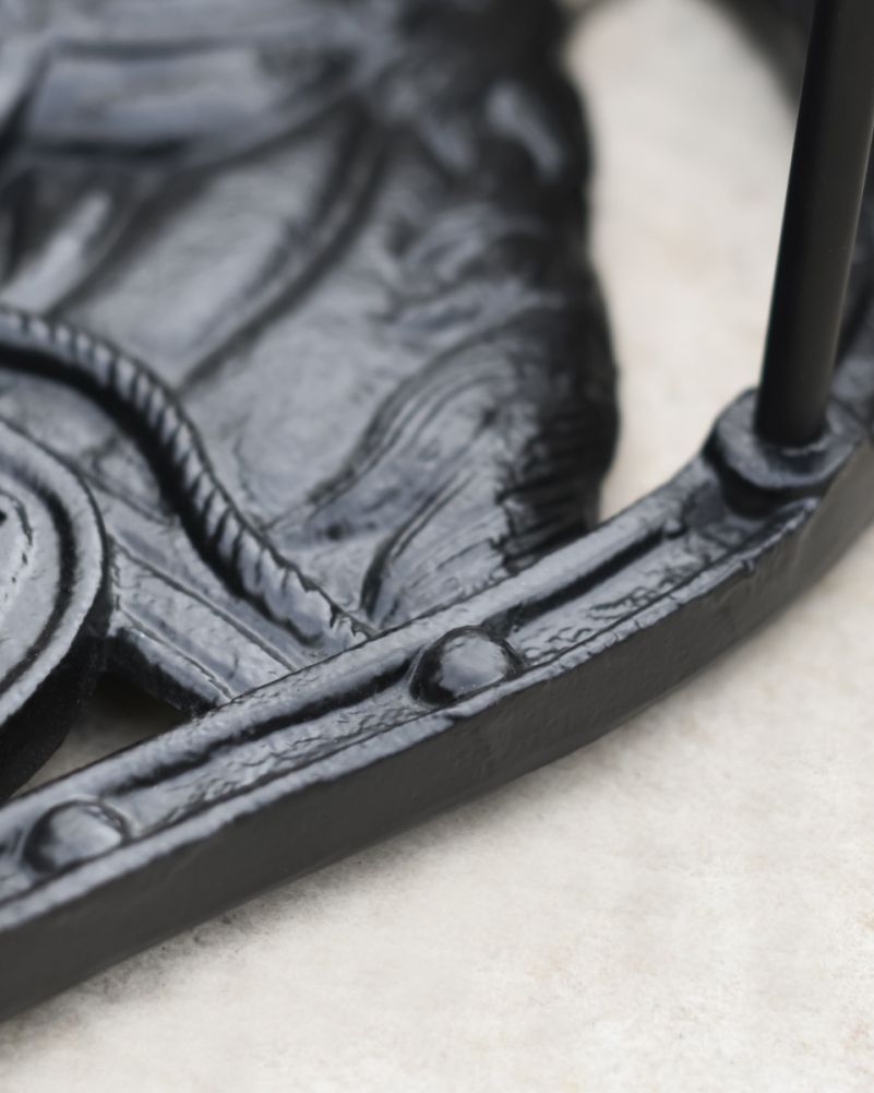 Close Up Of Horse Head Boot Stand & Scraper In Black Horse Shoe