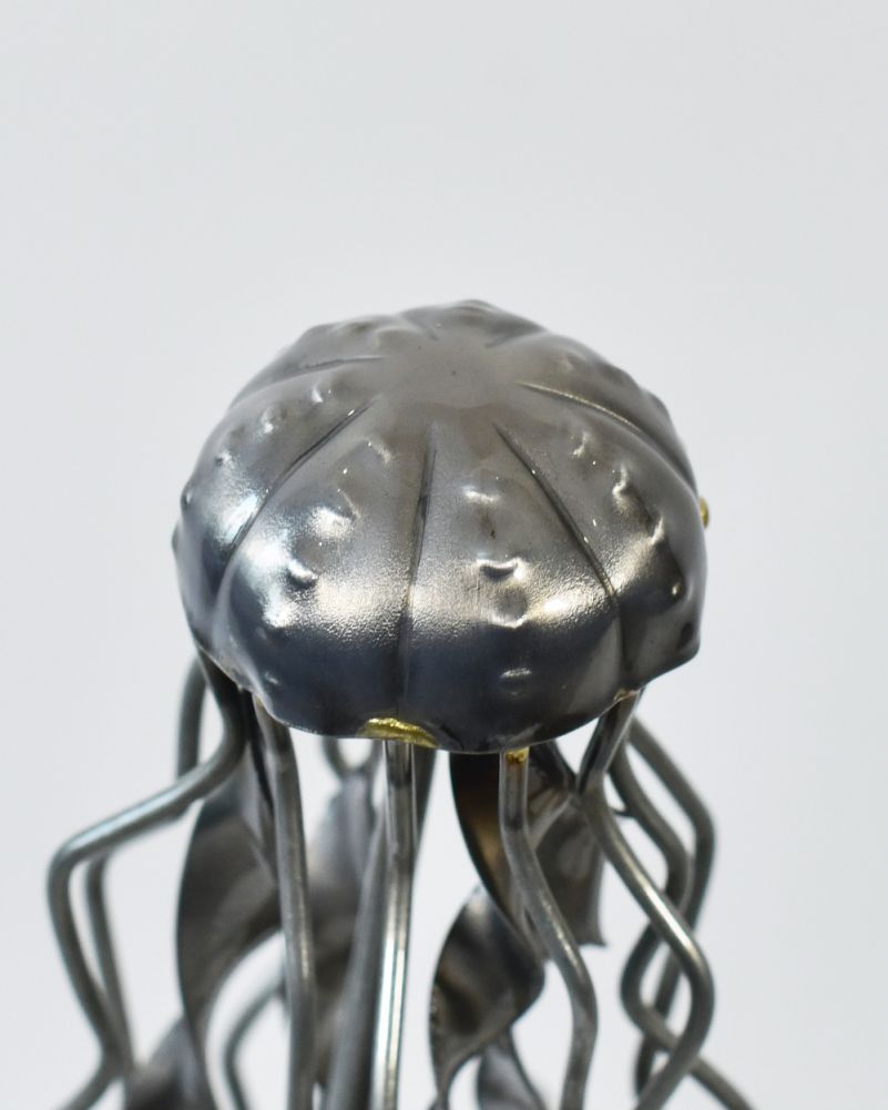 Close Up Of 'Lumi' The Jellyfish Scrap Metal Art Sculpture With Solid Wood Base