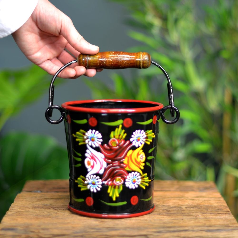 Small Black Narrowboat Hand Painted Bucket With Hand For Scale