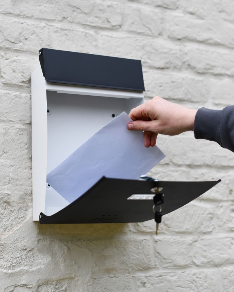 Modern black and white postbox open