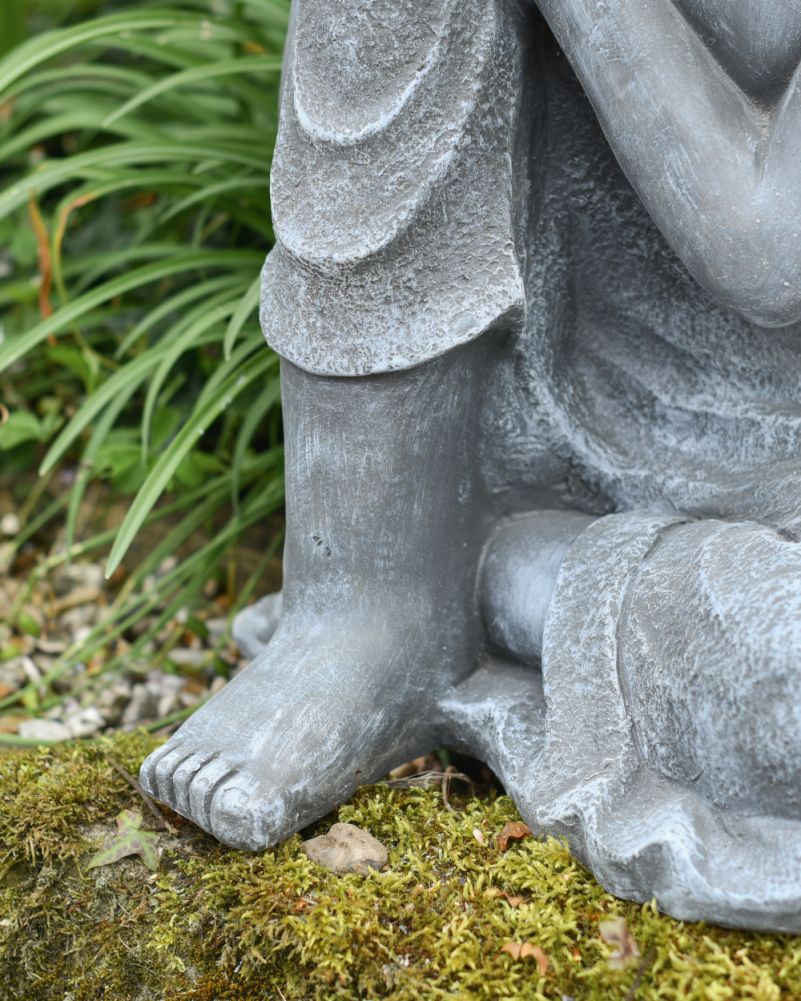 Close Up Details of The Resin Sitting Buddha Sculpture