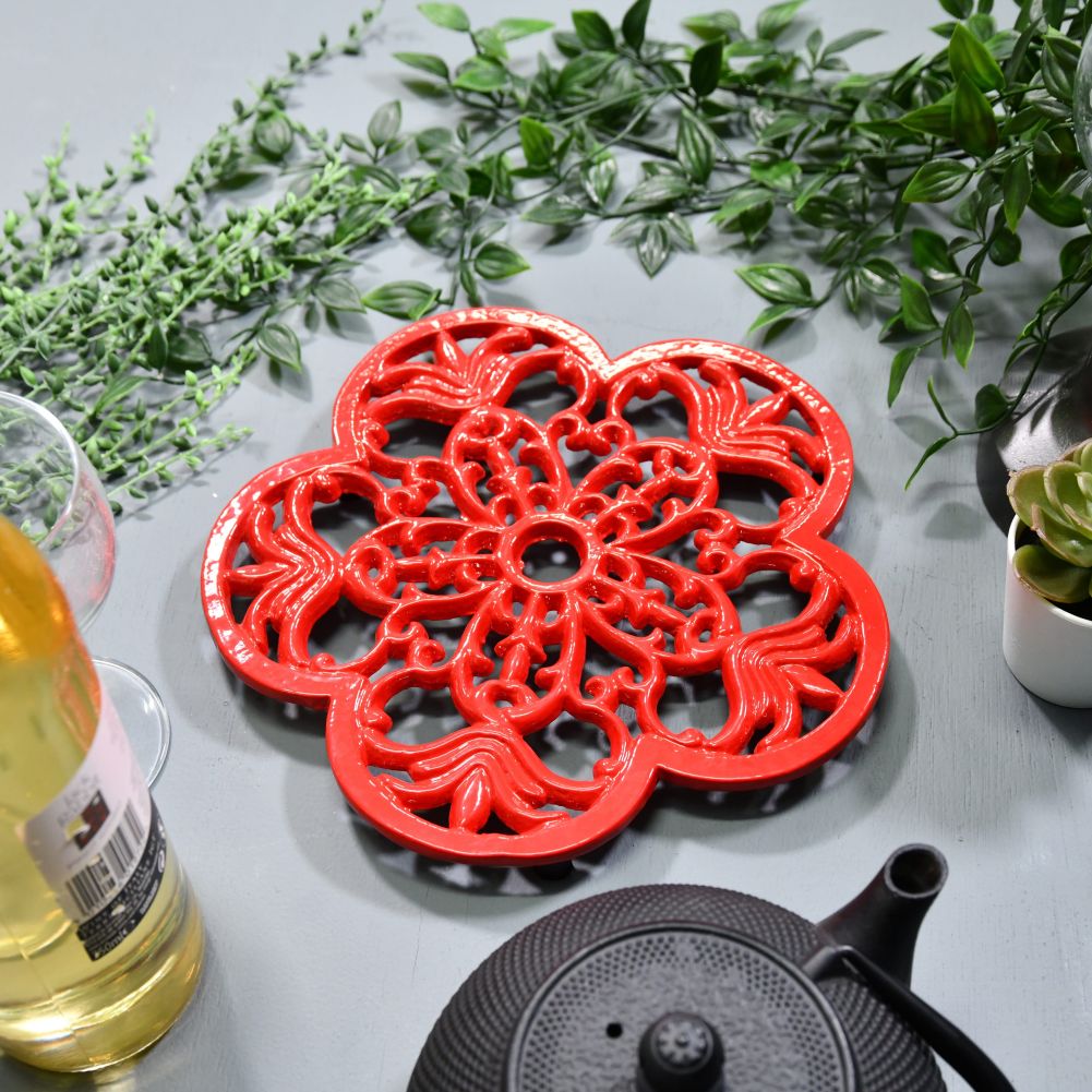Red Cast Iron Flower Trivet in Situ with Teapot