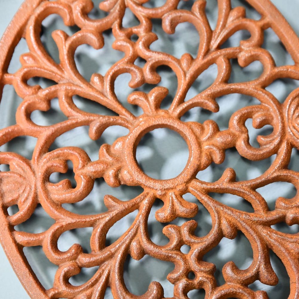 Close up of rustic cast iron trivet design