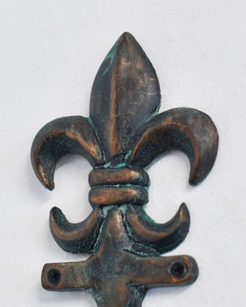 Close Up Of The Ornate Cast Aluminium Fleur-De-Lis Verdigris Hook