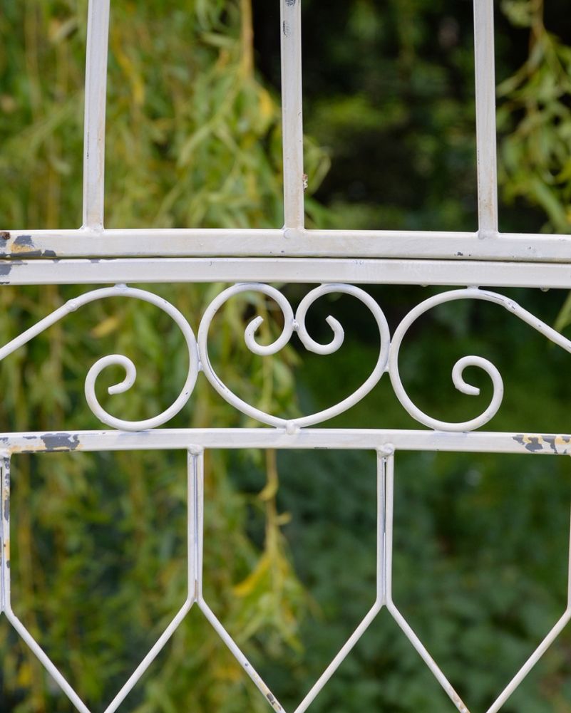 Ornate Design On The Rustic Cream Garden Arbour