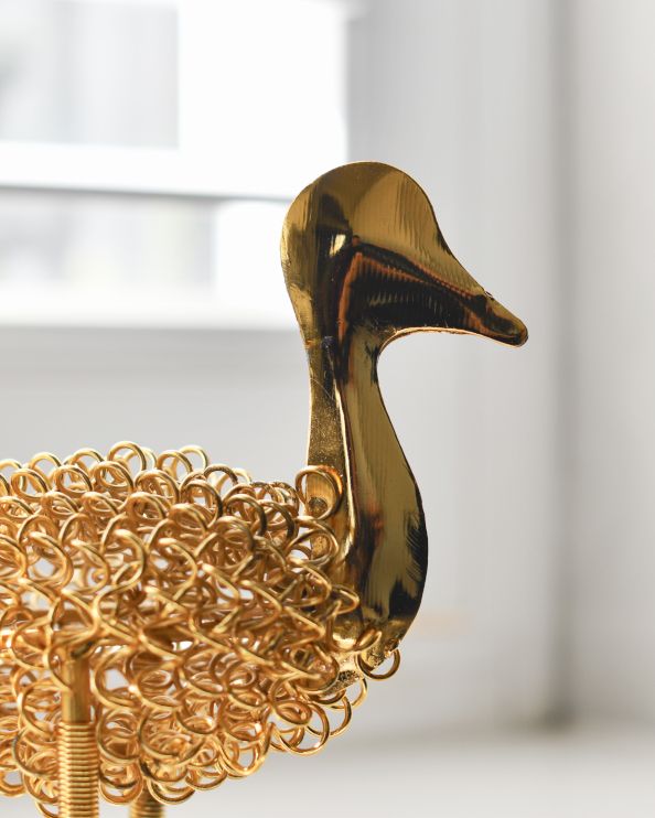 Close Up Of The Face On 'Quackle' The Colourful Duck Scrap Metal Art Sculpture - Gold