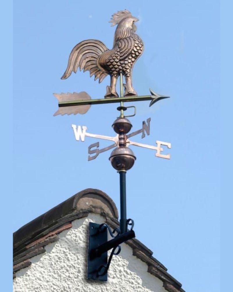 Rooster Copper Weathervane In A Blue Sky Setting