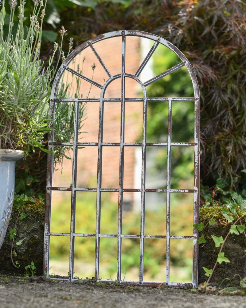 Rustic Arched Wall Mirror In A Setting