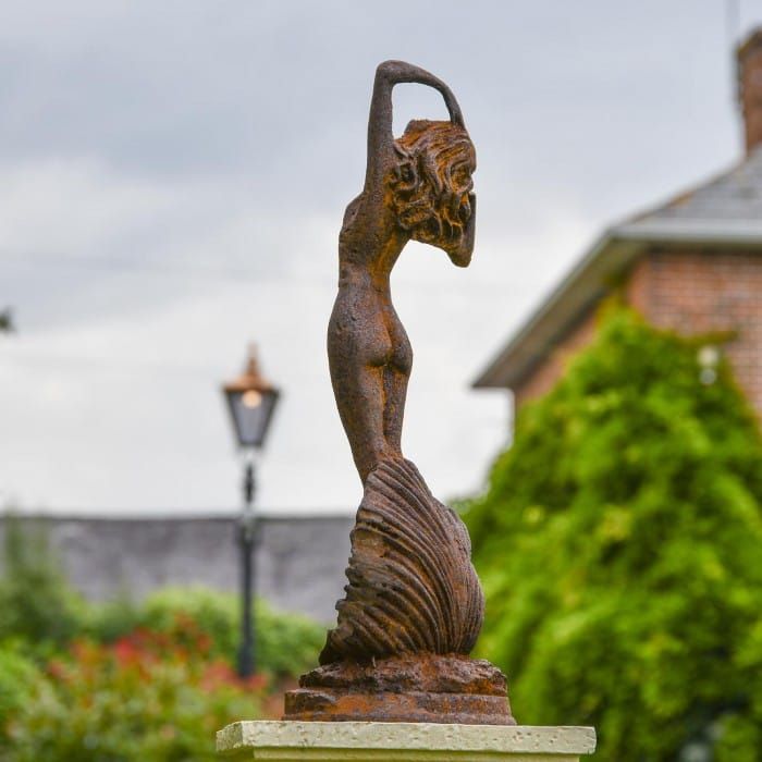 Lady Standing on Clam Sculpture - Rustic In Situ