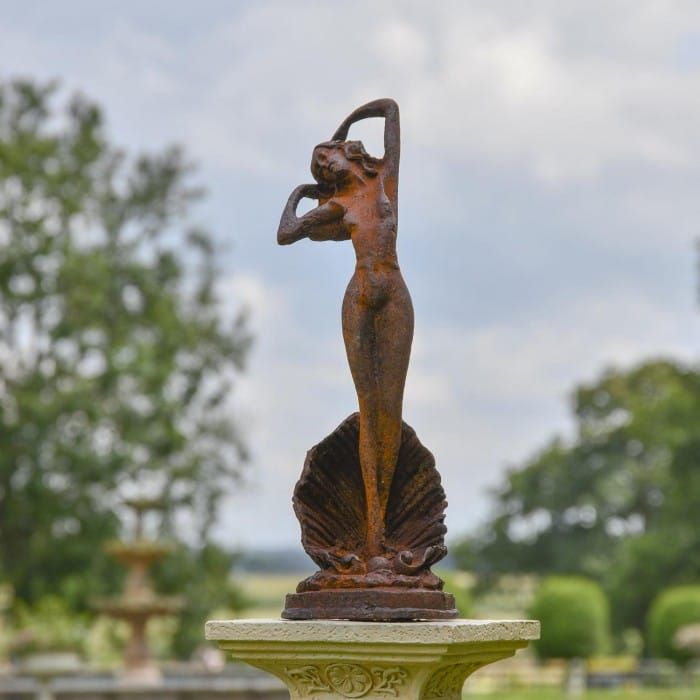 Lady Standing on Clam Sculpture - Rustic In Situ