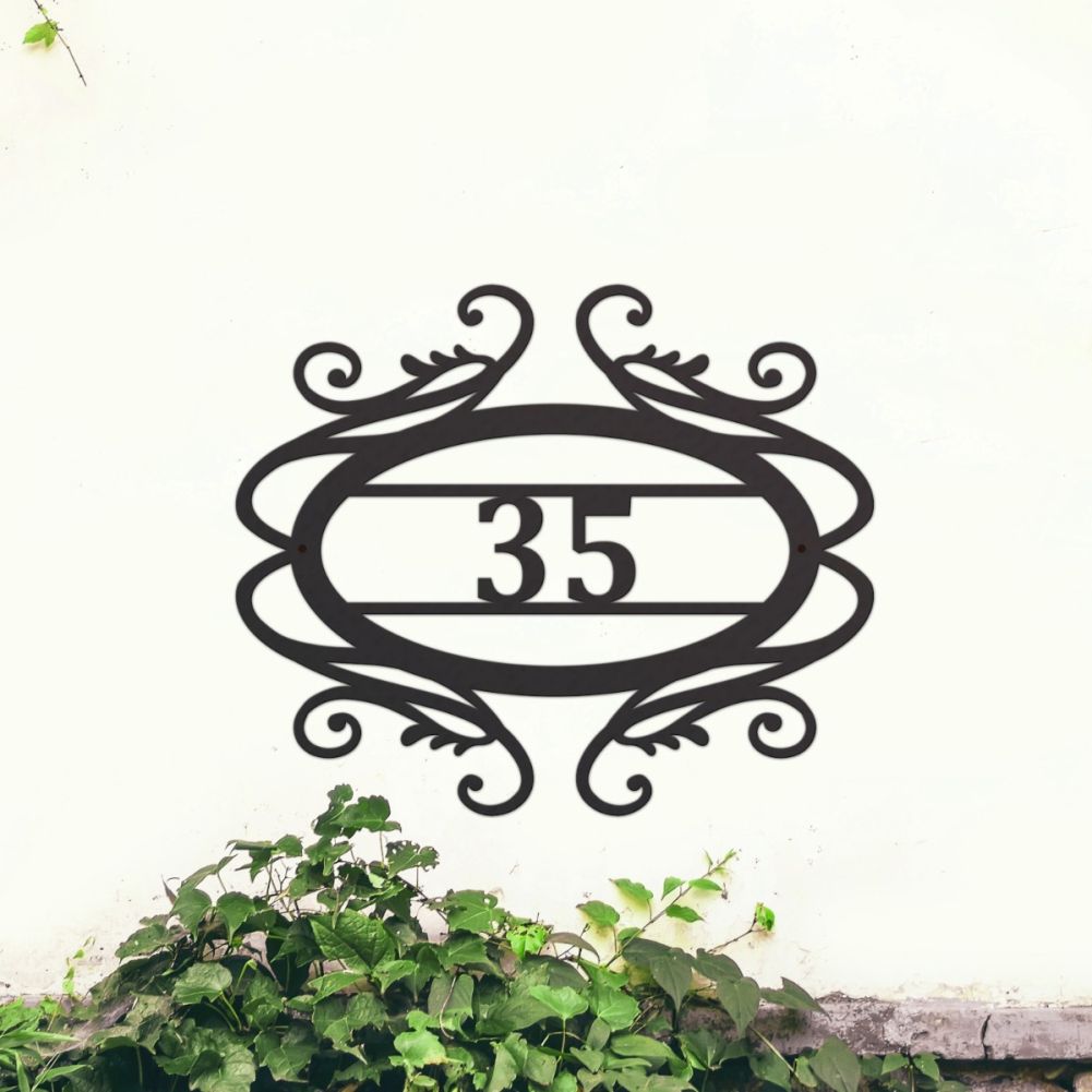 Scrolled House Number Sign On A Wall