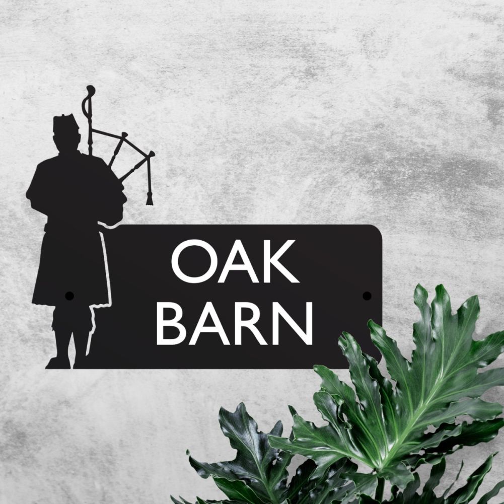 Steel Bagpiper House Sign On A Grey Wall